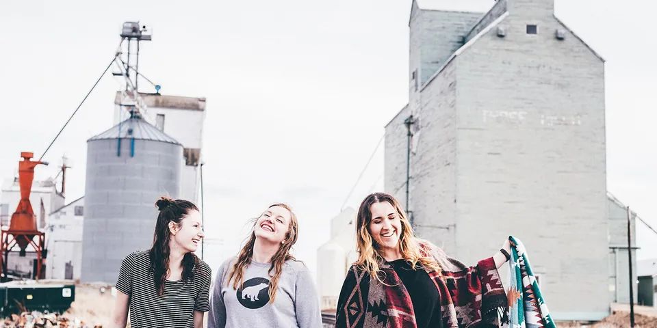 Four friends walking together outside